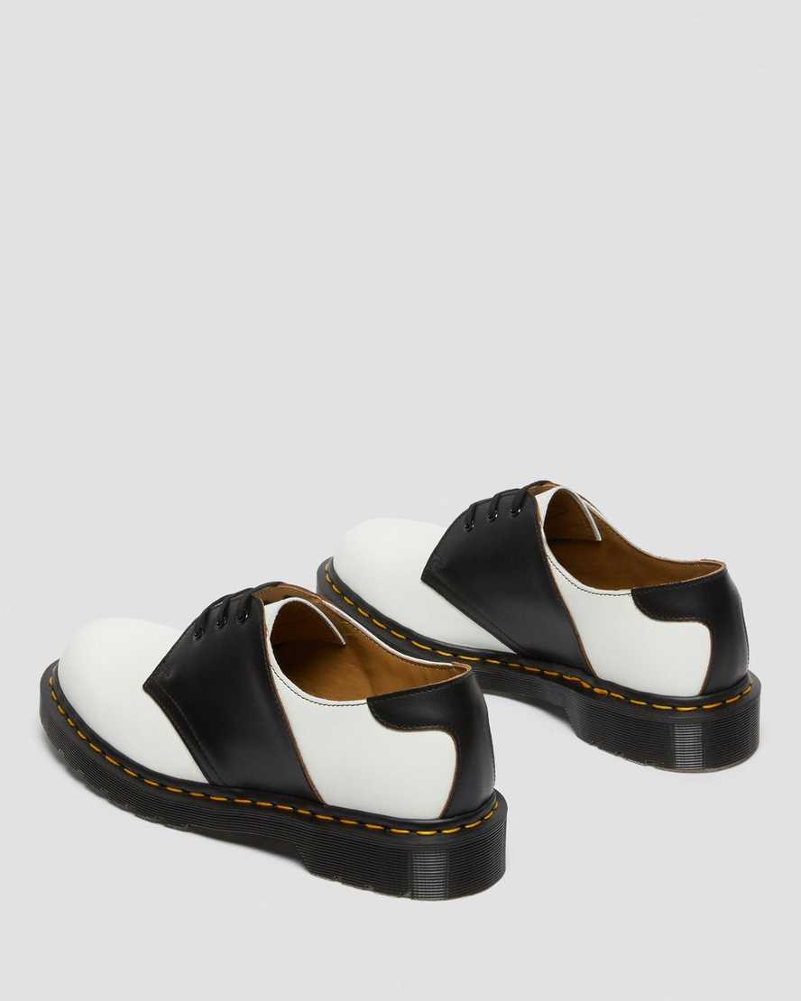 weiße und schwarze dr. martens 1461 herren-sattelschuhe