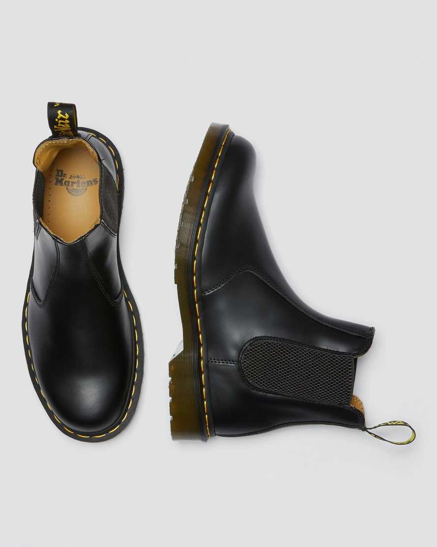 schwarze dr. martens 2976 chelsea boots mit gelben nähten für damen