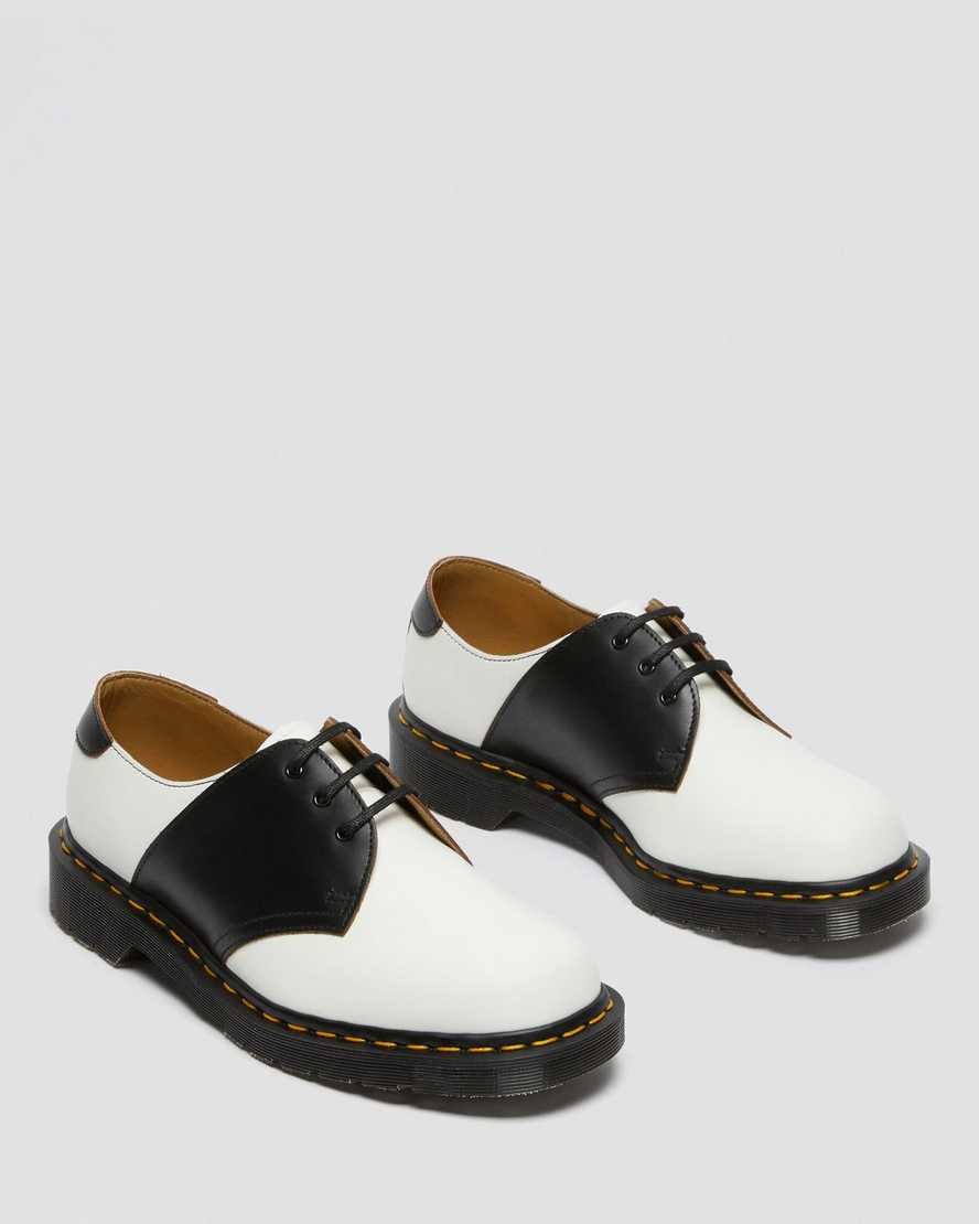 weiße und schwarze dr. martens 1461 damen-sattelschuhe